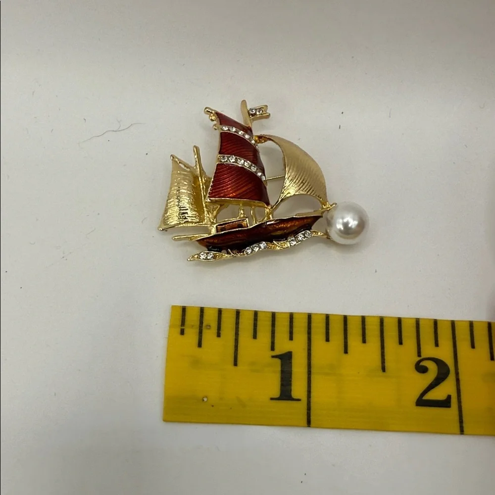 3/$25 Gold Tone and Red Sailboat Brooch with Rhinestone and Faux Pearl Accent